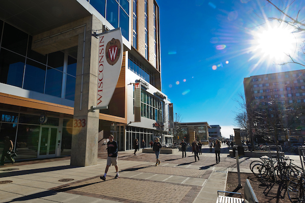Students walk by the the Student Services Tower at 333 East Campus Mall, home of University Health Services.