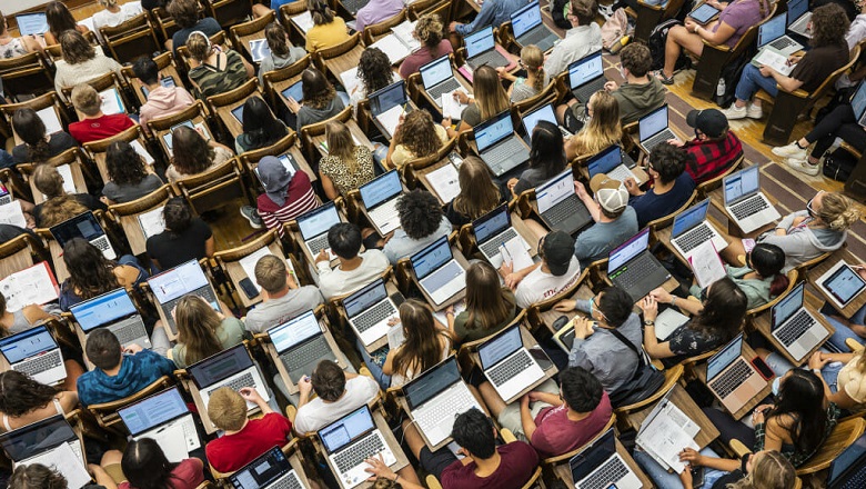 Aerial view of students in class with laptops